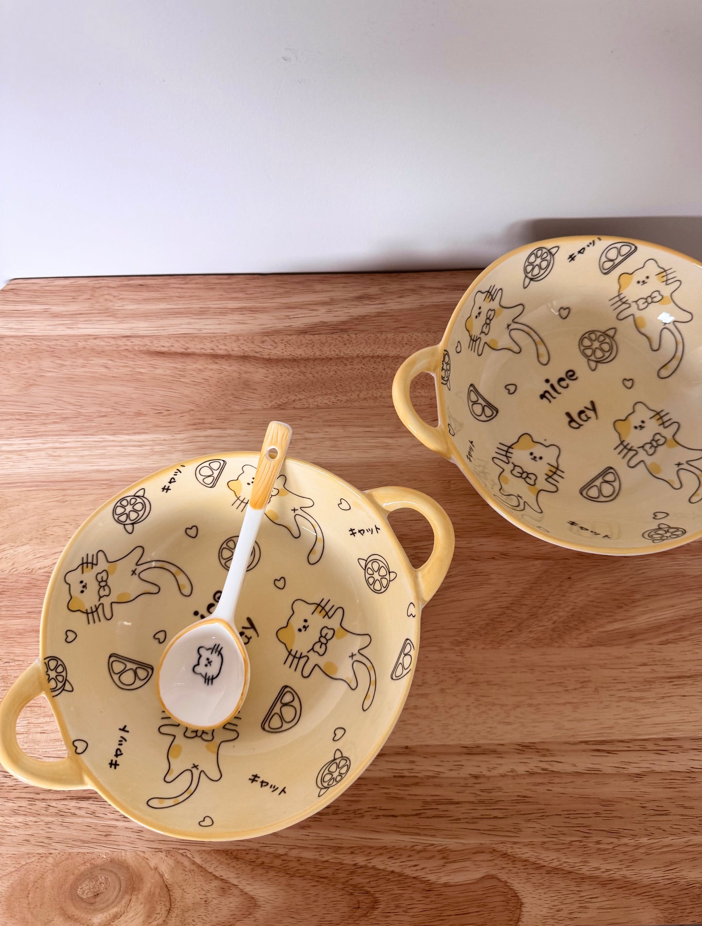 Kawaii yellow bowl with handles and spoon